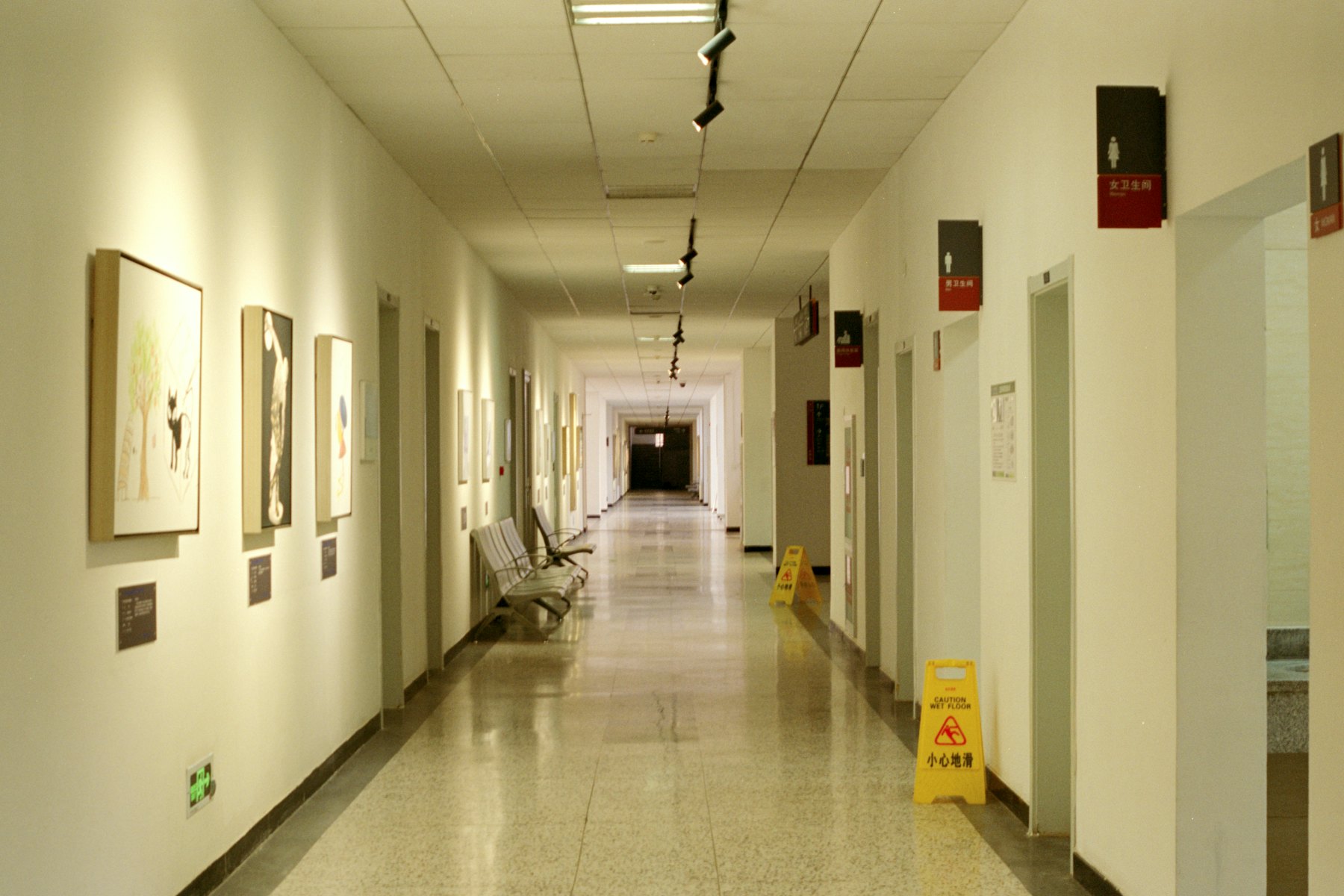 A quiet hospital corridor in warm daylight